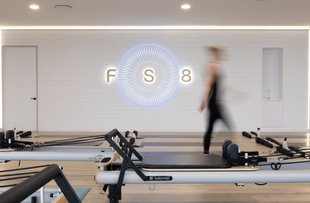 Pilates reformers, hardwood floors and welcoming reception area for this fitness fit out for FS8